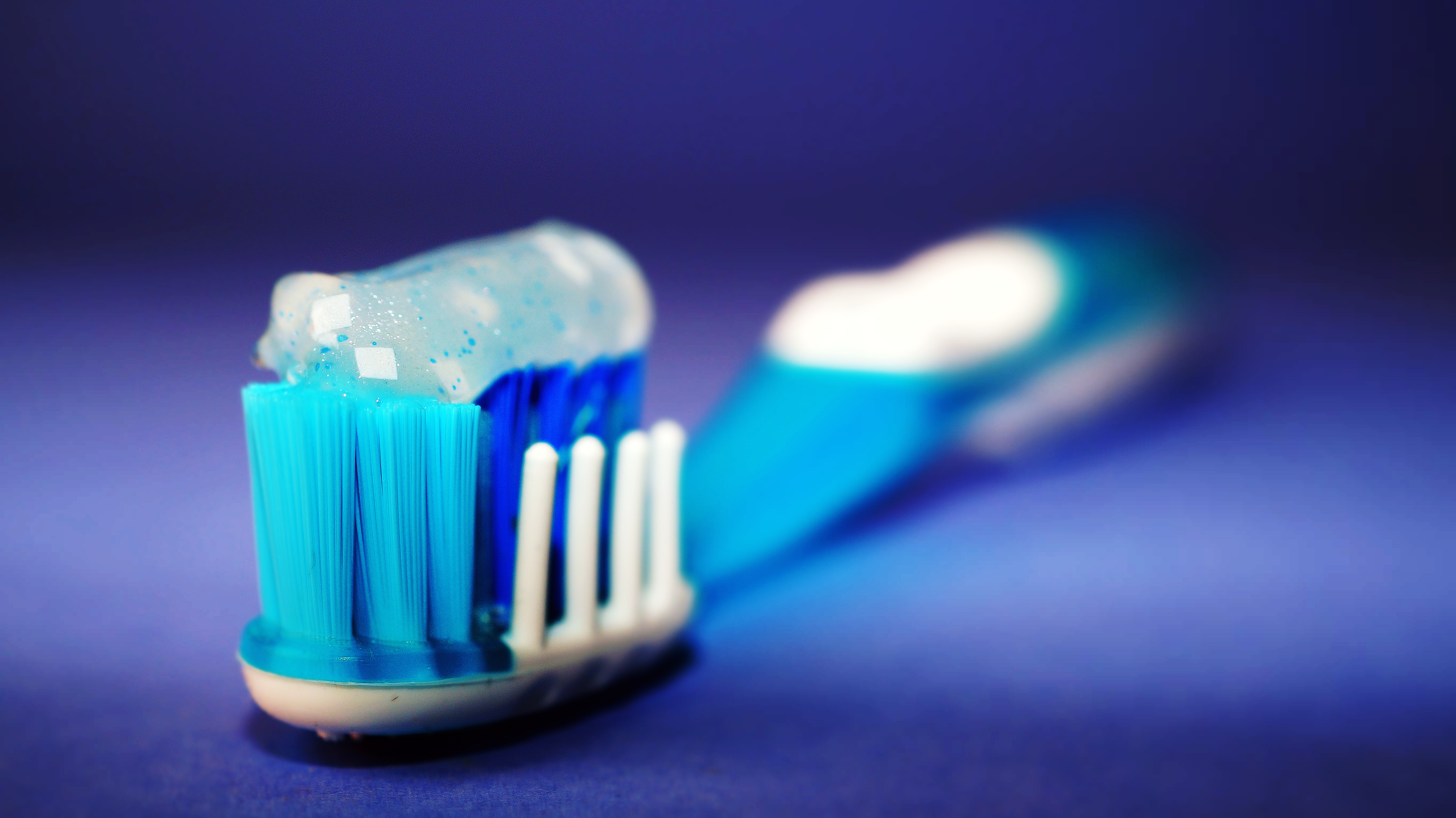 Canva - Closeup and Selective Focus Photography of Toothbrush With Toothpaste